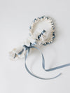 cream wedding garter set with dusty blue ribbon and embroidery handmade by wedding expert The Garter Girl