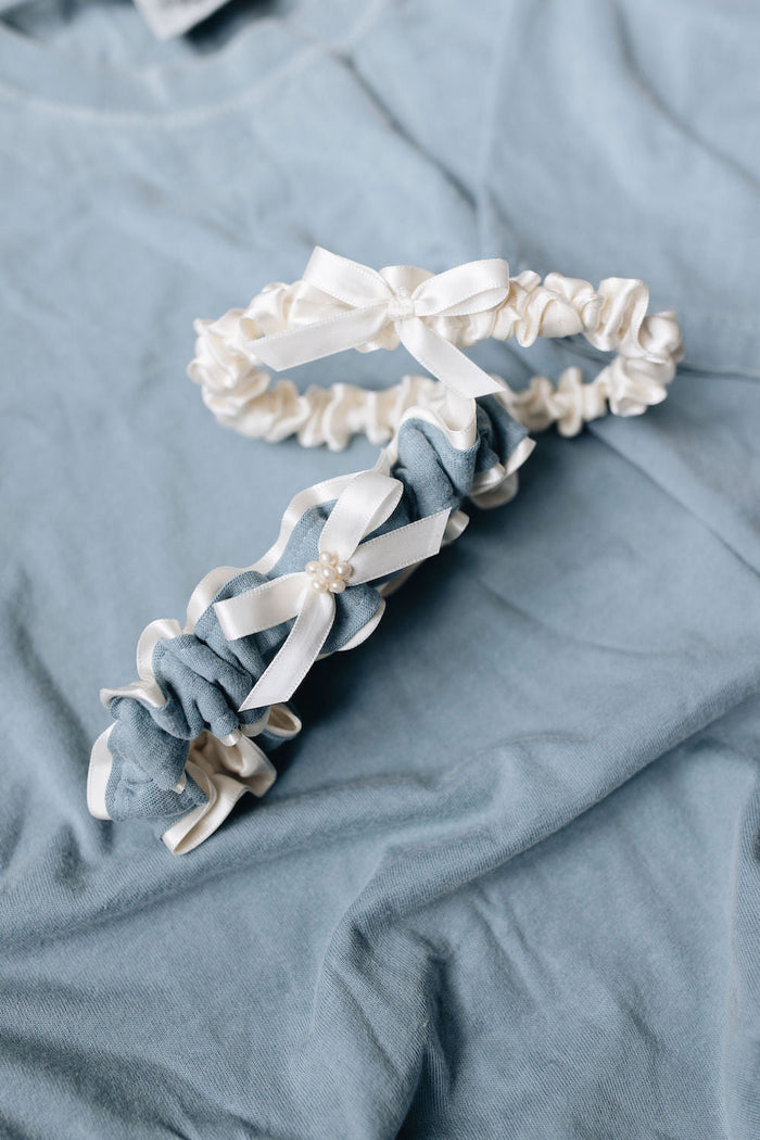 custom garter set with ivory satin tossing garter and ivory tulle and pearls main garter with blue stripe from dad's t-shirt handmade by The Garter Girl