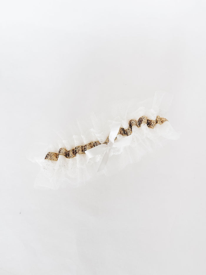 custom keepsake wedding garter heirloom with ivory lace and tulle with a gold band detail and a short-tail ivory satin bow handmade by The Garter Girl