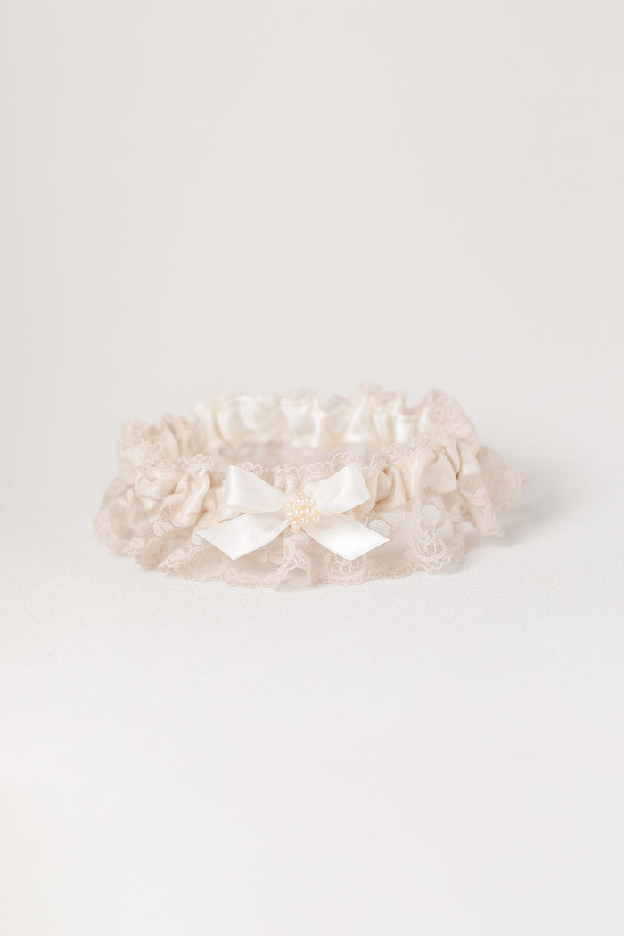 custom garter set with pearls and champagne lace