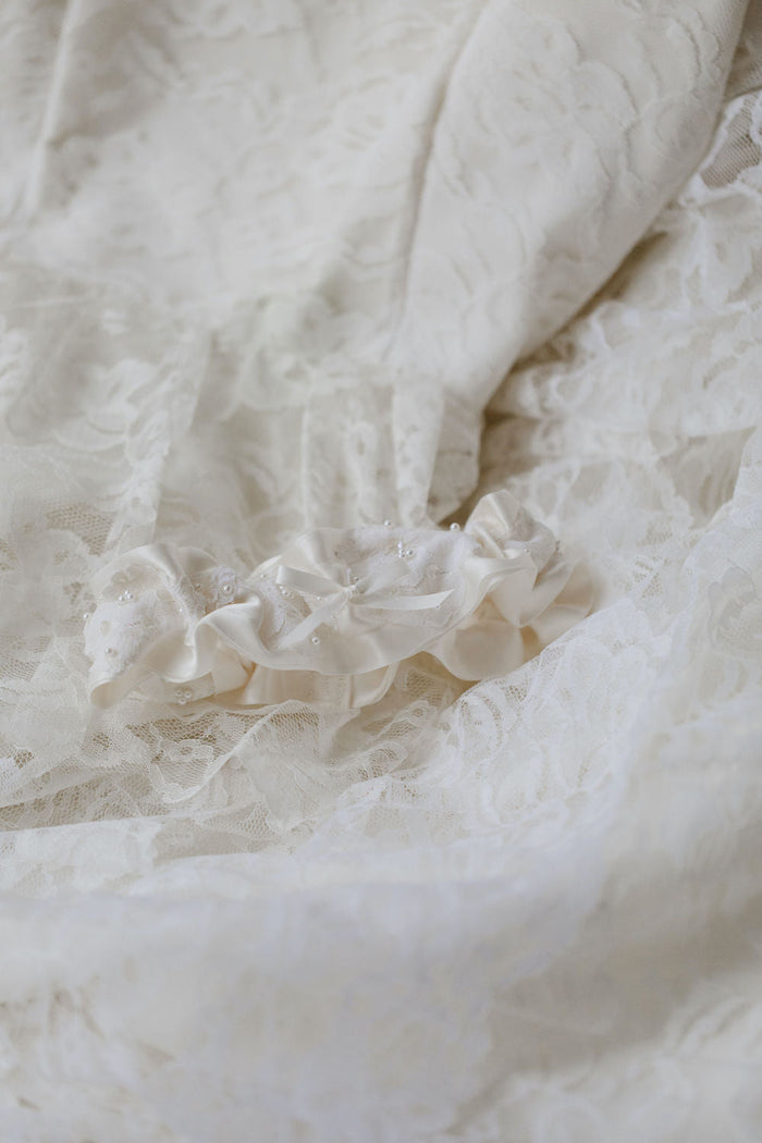 wedding garter handmade with lace and pearls from the collar of the mother's wedding dress by The Garter Girl