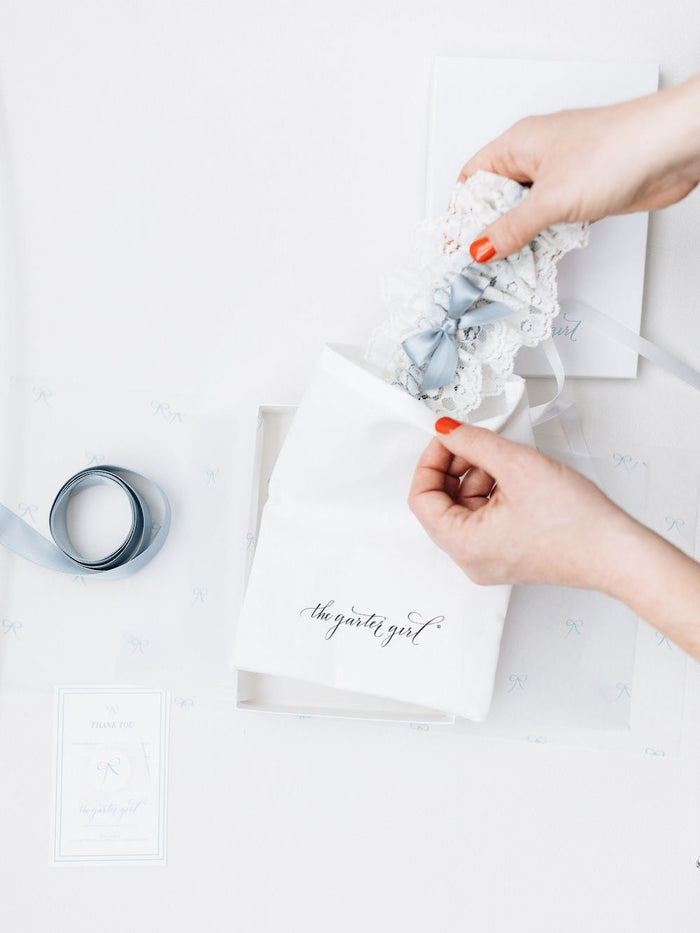 free discount coupon code for a designer wedding garter heirloom from The Garter Girl, something blue lace wedding garter in couture keepsake gift box