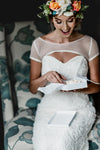 bride opening wedding garter by The Garter Girl