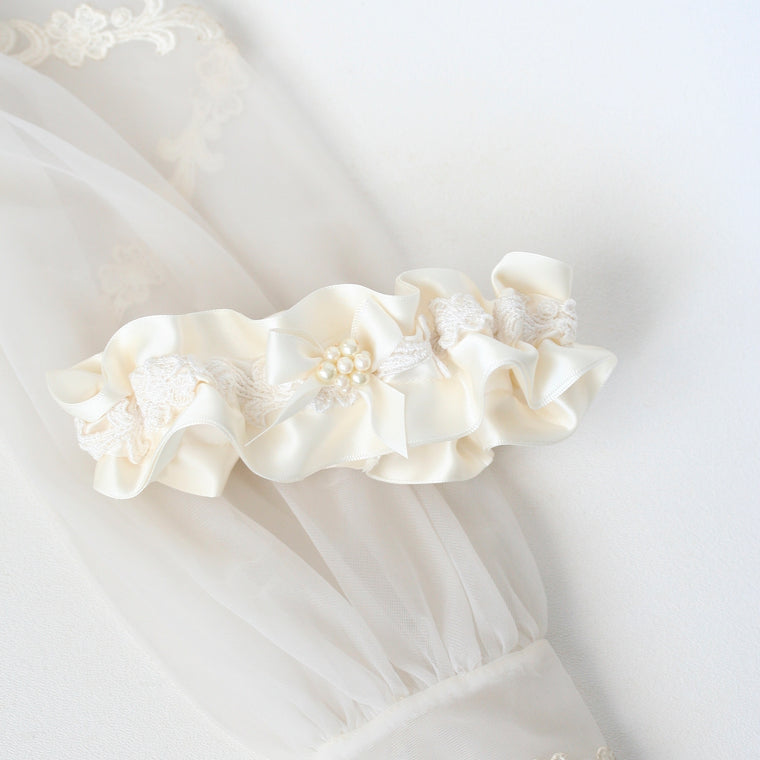 pearl garter made from bride's mother's wedding dress sleeve by The Garter Girl