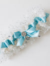 unique wedding garter with sparkly tulle & turquoise satin with rhinestone detail and heirloom turquoise wedding ring handmade by The Garter Girl