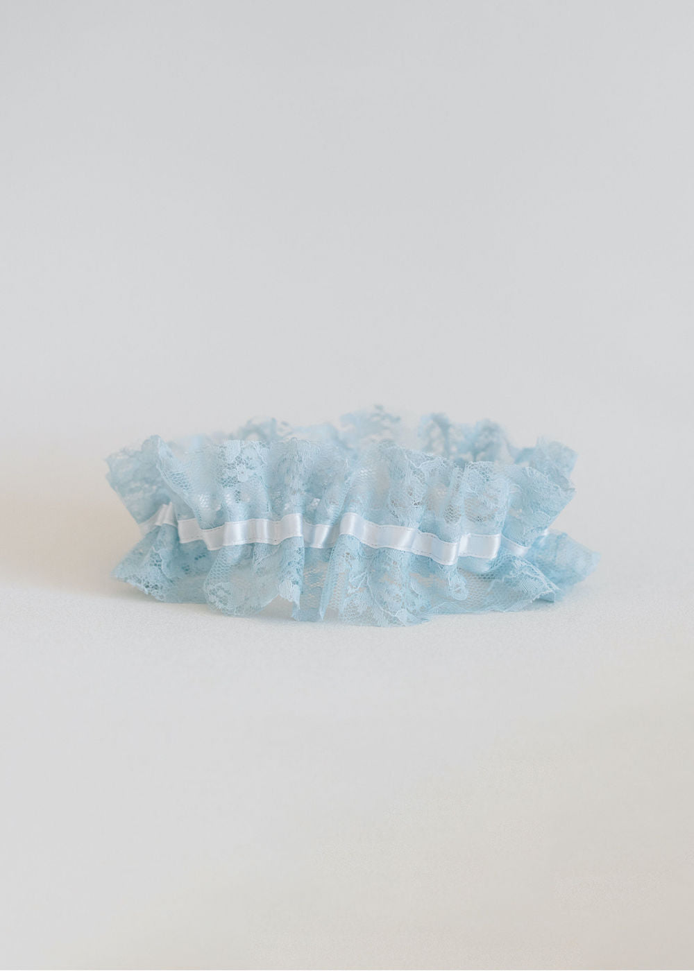 custom wedding garter set handmade with blue lace and white satin by expert bridal accessory designer, The Garter Girl