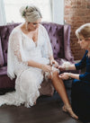 Mom Helps Bride Place Custom Bridal Garter