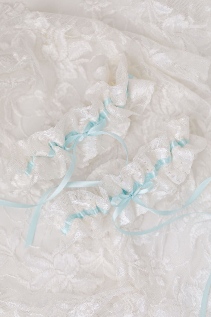 custom wedding garters for sisters made from their mother's wedding dress lace