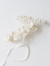 custom made ivory satin wedding garter with long-tailed bow on main garter and simple matching tossing garter handmade by The Garter Girl