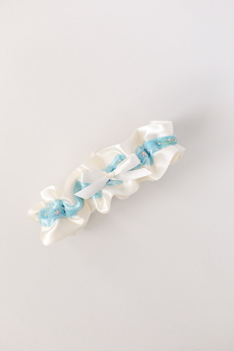 custom garter with blue velvet with flowers and sparkle