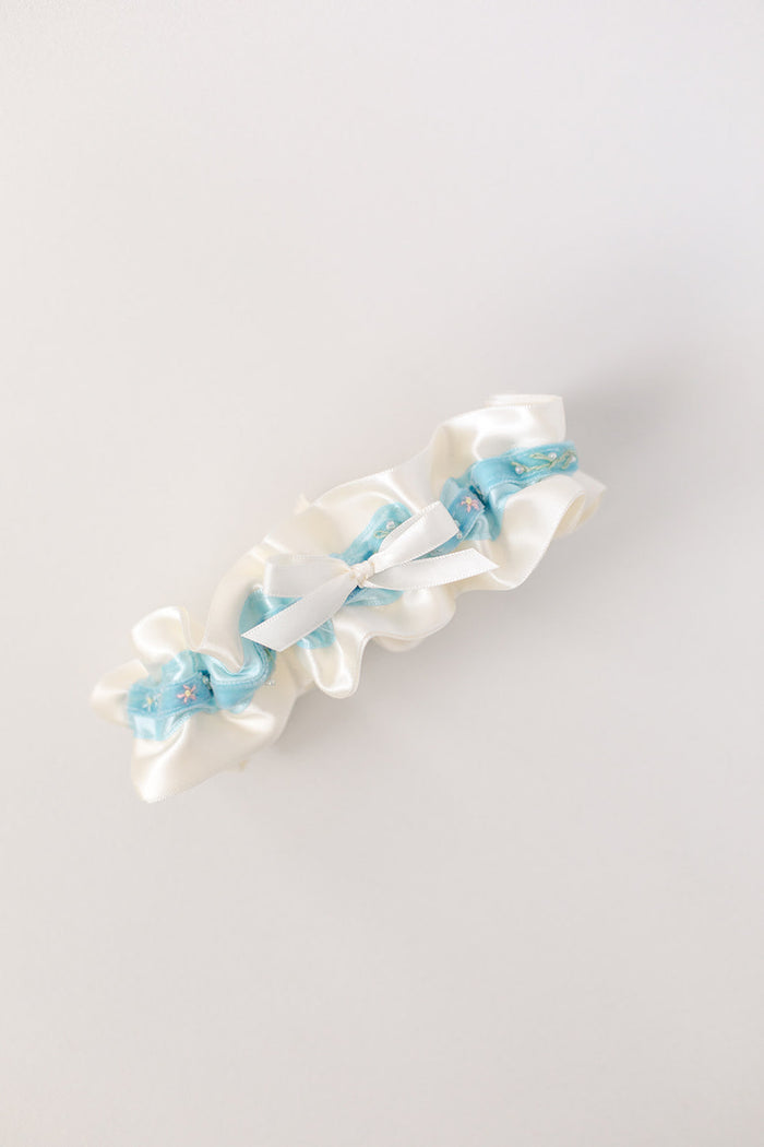 custom garter with blue velvet with flowers and sparkle