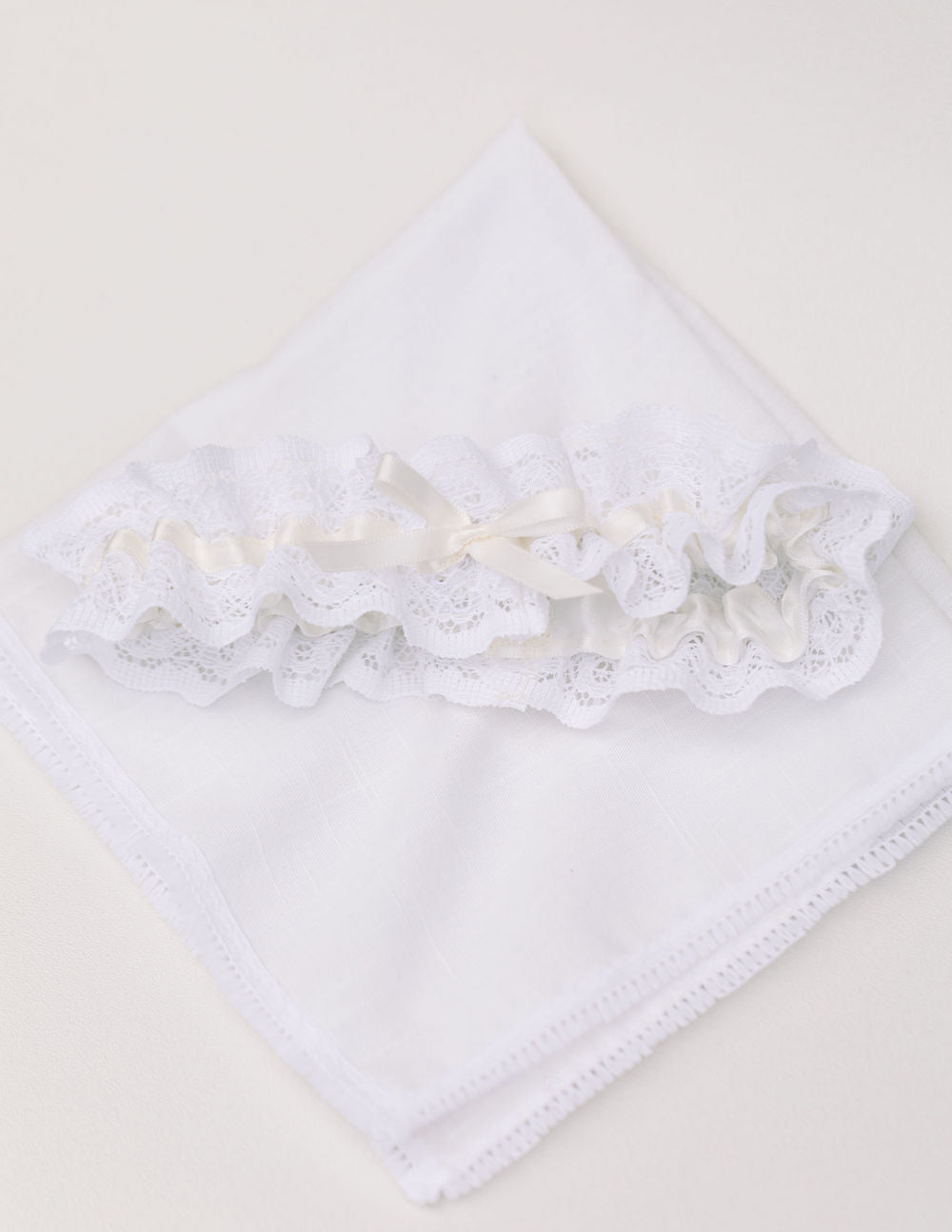 wedding garter heirloom handmade from the bride's grandmother's lace handkerchief and personalized with something blue embroidery by The Garter Girl
