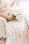 all white flowers bridal bouquet with tips for planning wedding from The Garter Girl