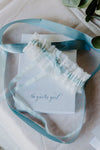 lace and blue ribbon wedding garter