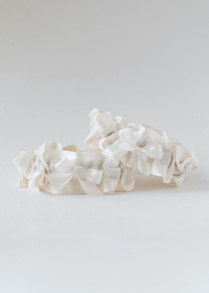 wedding garters handmade from bride's great grandmother's wedding dress lace material scraps w/ patch, embroidery, monogram & button detail, by expert bridal accessories designer, The Garter Girl