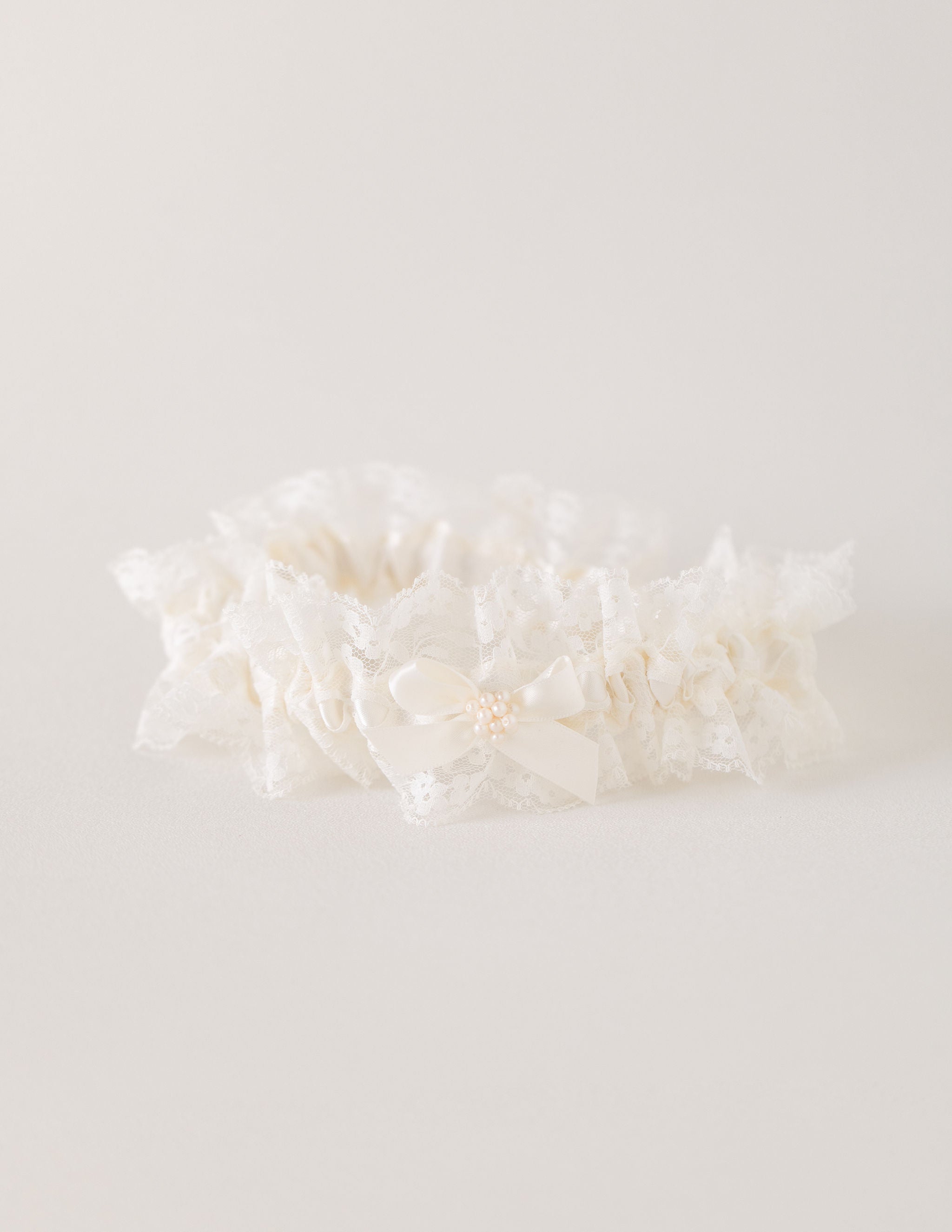 custom wedding garter heirloom with lace and pearls by The Garter Girl