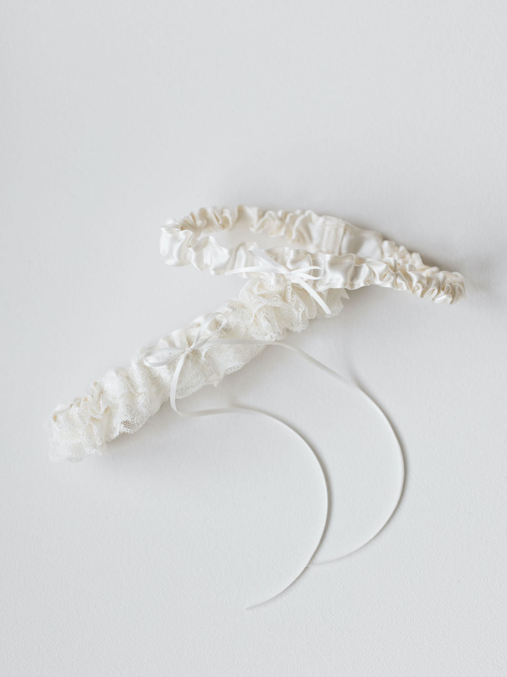 ivory lace ruffled wedding garter set personalized with hand embroidery by The Garter Girl