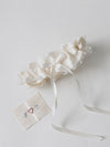 ivory satin wedding garter with lace overlay and special hand-embroidered patch inside handcrafted by wedding expert The Garter Girl