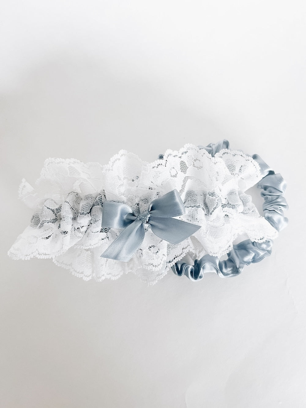 Custom wedding garter set handmade with ivory lace and something blue satin by top wedding garter design expert, The Garter Girl