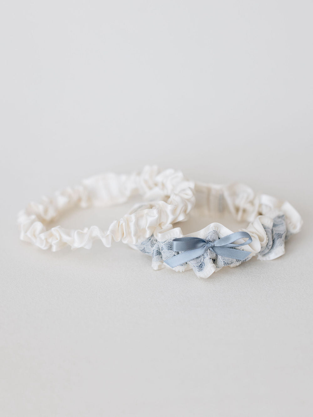 wedding garter set with ivory & blue satin, lace, and bow with personalized embroidery - a handmade wedding heirloom by The Garter Girl
