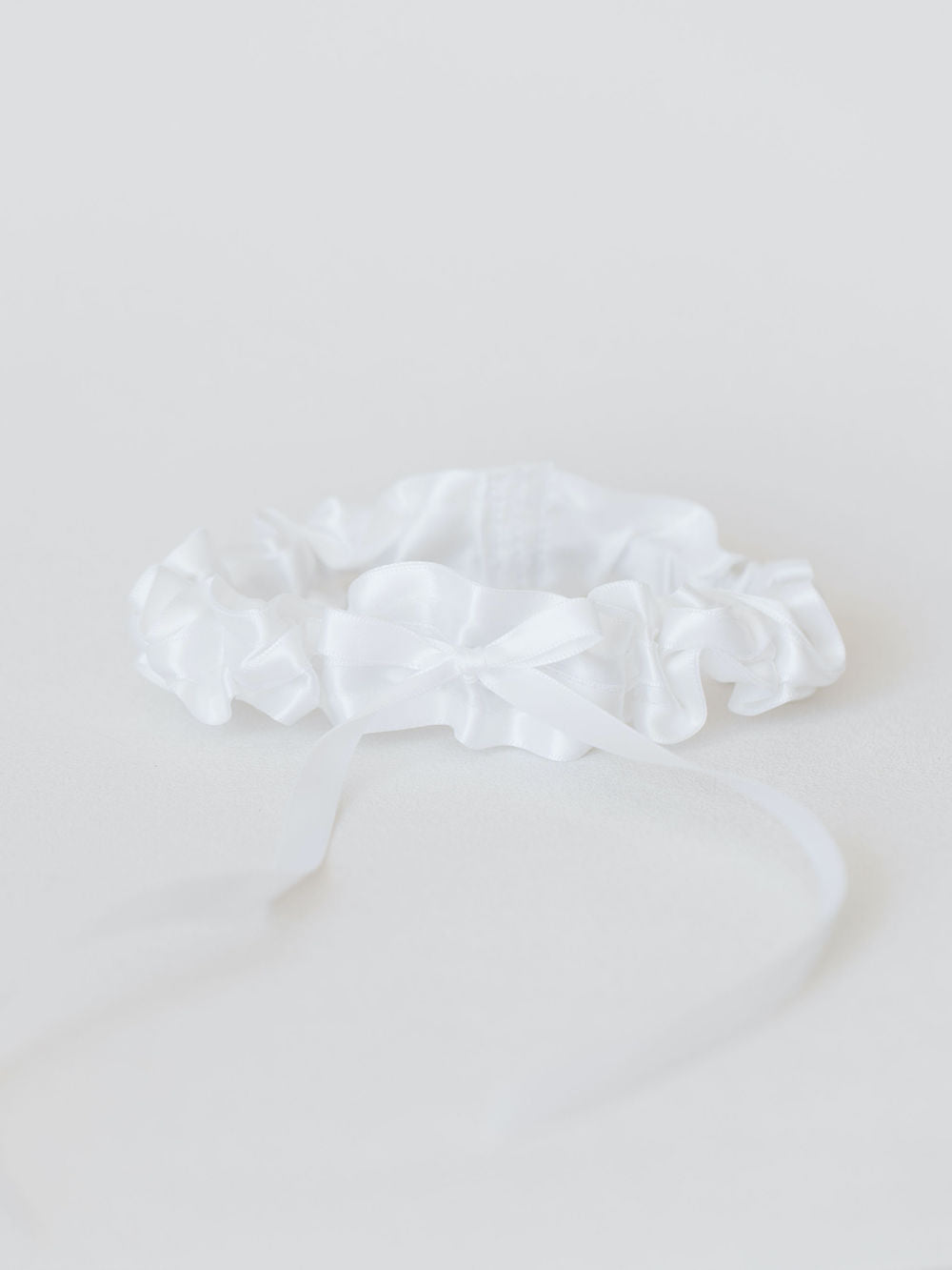 classic white satin wedding garter with something blue personalized embroidery by expert wedding accessories designer, The Garter Girl