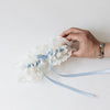 Classic ivory lace wedding garter with something blue satin handmade by The Garter Girl