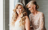 Bride and her mom getting ready on wedding day with tulle and pearl wedding garter heirloom by The Garter Girl