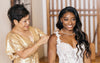 Simone Biles and her mother getting ready on wedding day with heirloom sparkle wedding garter by The Garter Girl