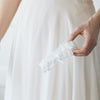 white eyelet lace and satin wedding garter by The Garter Girl