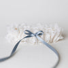 Shop The Garter Girl's handmade wedding garter heirloom with beautiful ivory lace and a something blue satin bow.