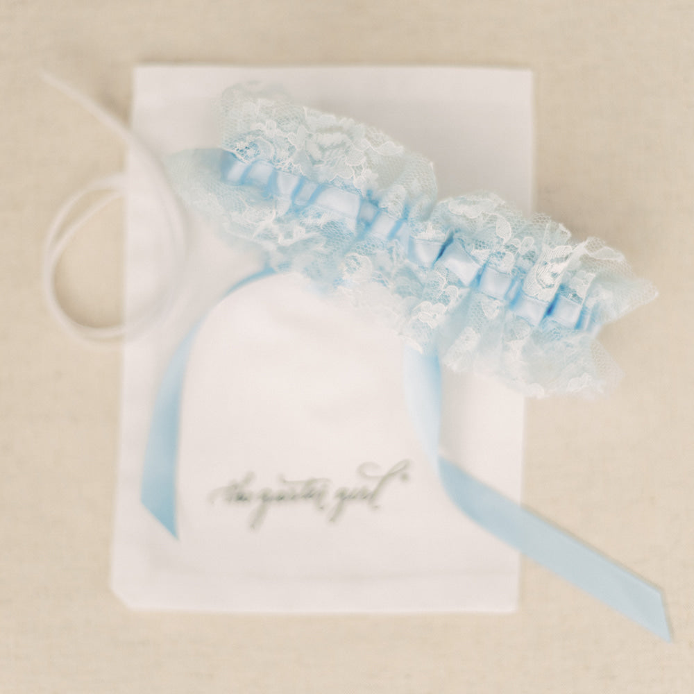 Shop our heirloom blue lace bridal garter for something blue at your wedding.