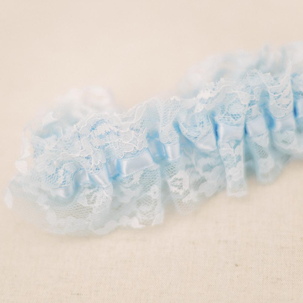 Shop our heirloom blue lace bridal garter for something blue at your wedding.