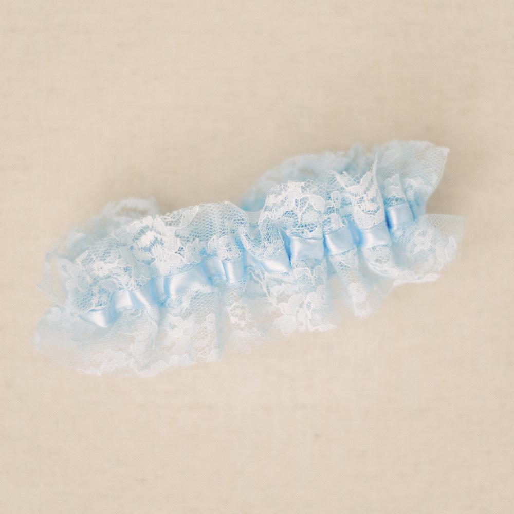 Shop our heirloom blue lace bridal garter for something blue at your wedding.