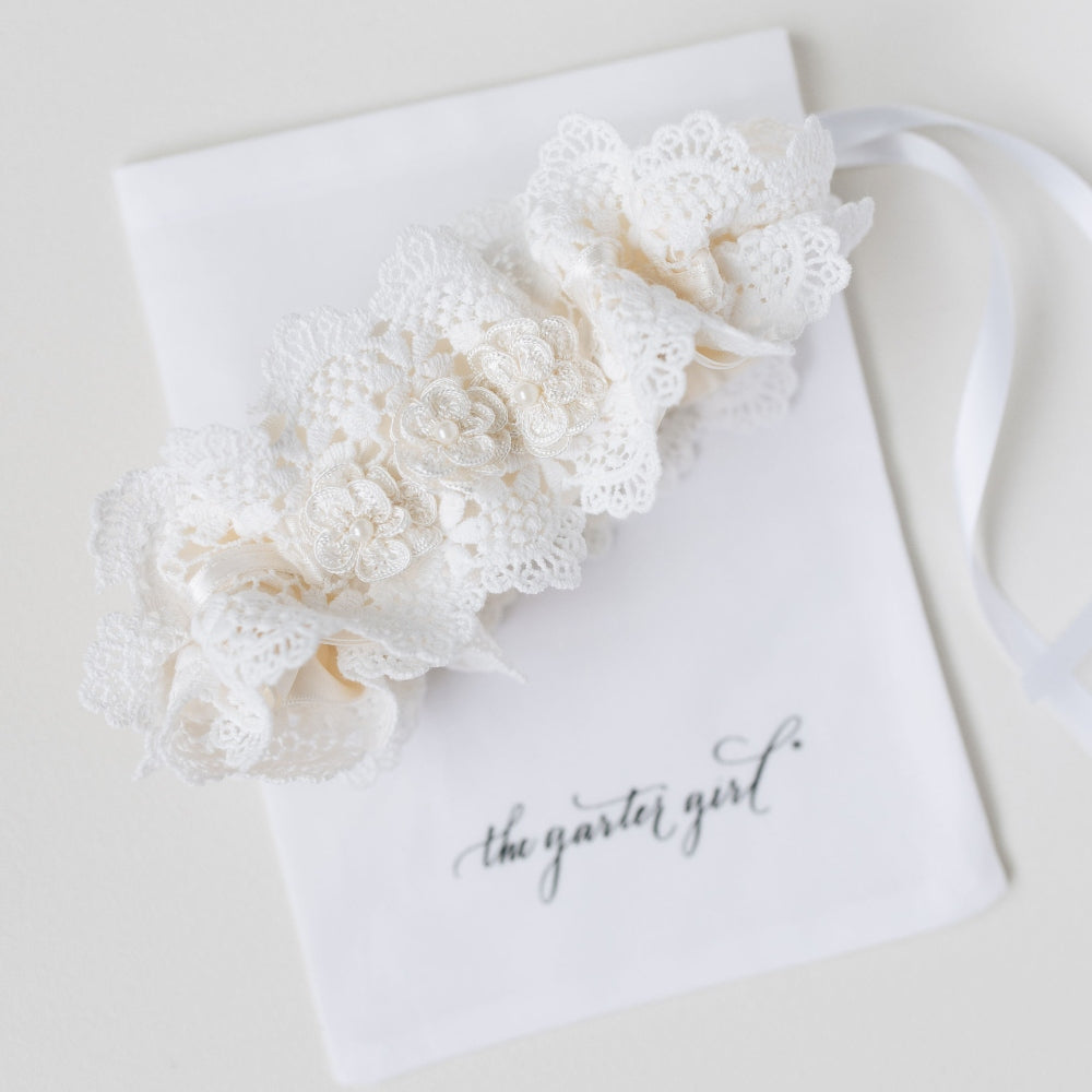 Shop our luxury lace wedding garter handmade with pearls, the perfect bridal accessory & wedding heirloom from The Garter Girl