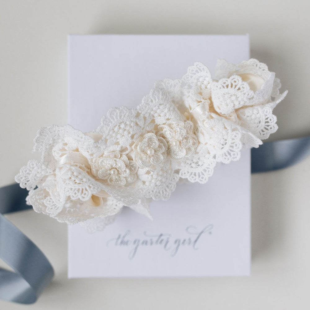Shop our luxury lace wedding garter handmade with pearls, the perfect bridal accessory & wedding heirloom from The Garter Girl