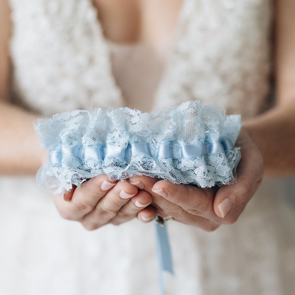 Shop our heirloom blue lace bridal garter for something blue at your wedding.