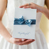Shop our heirloom ivory satin and lace bridal garter with elegant blue ribbon.