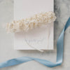 Shop our heirloom wedding garter with ivory lace and bow.
